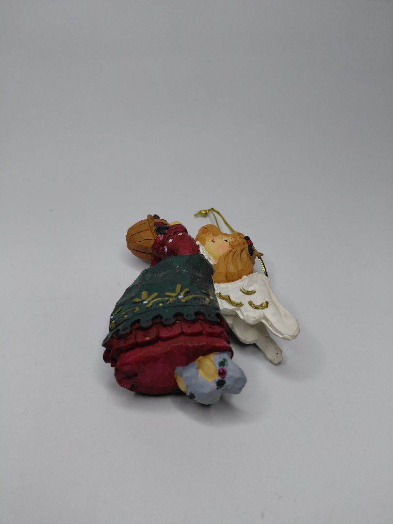 Christmas ornament - Angel holding a basket of flowers